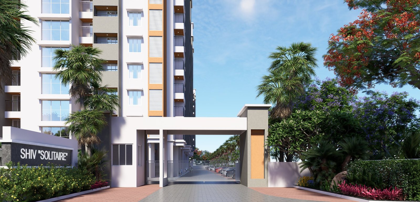 The entrance gate at Shiv Solitaire, with the project signage, landscaped planting and the wings rising behind